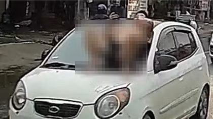 Nguyên nhân người đàn ông nằm nắp capo ô tô đang chạy